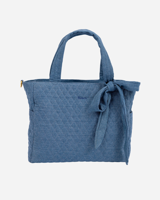Blue tote bag with a bow on a white background