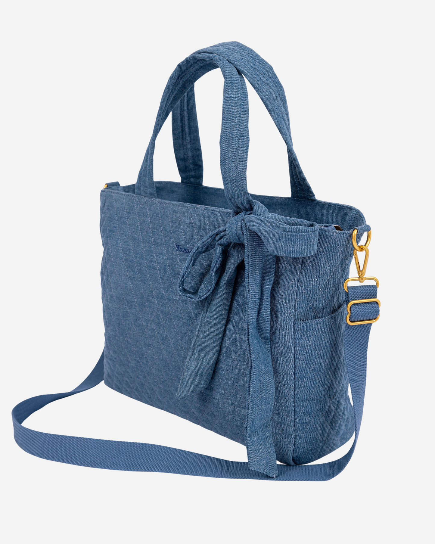 denim tote bag with a strap on a light gray background