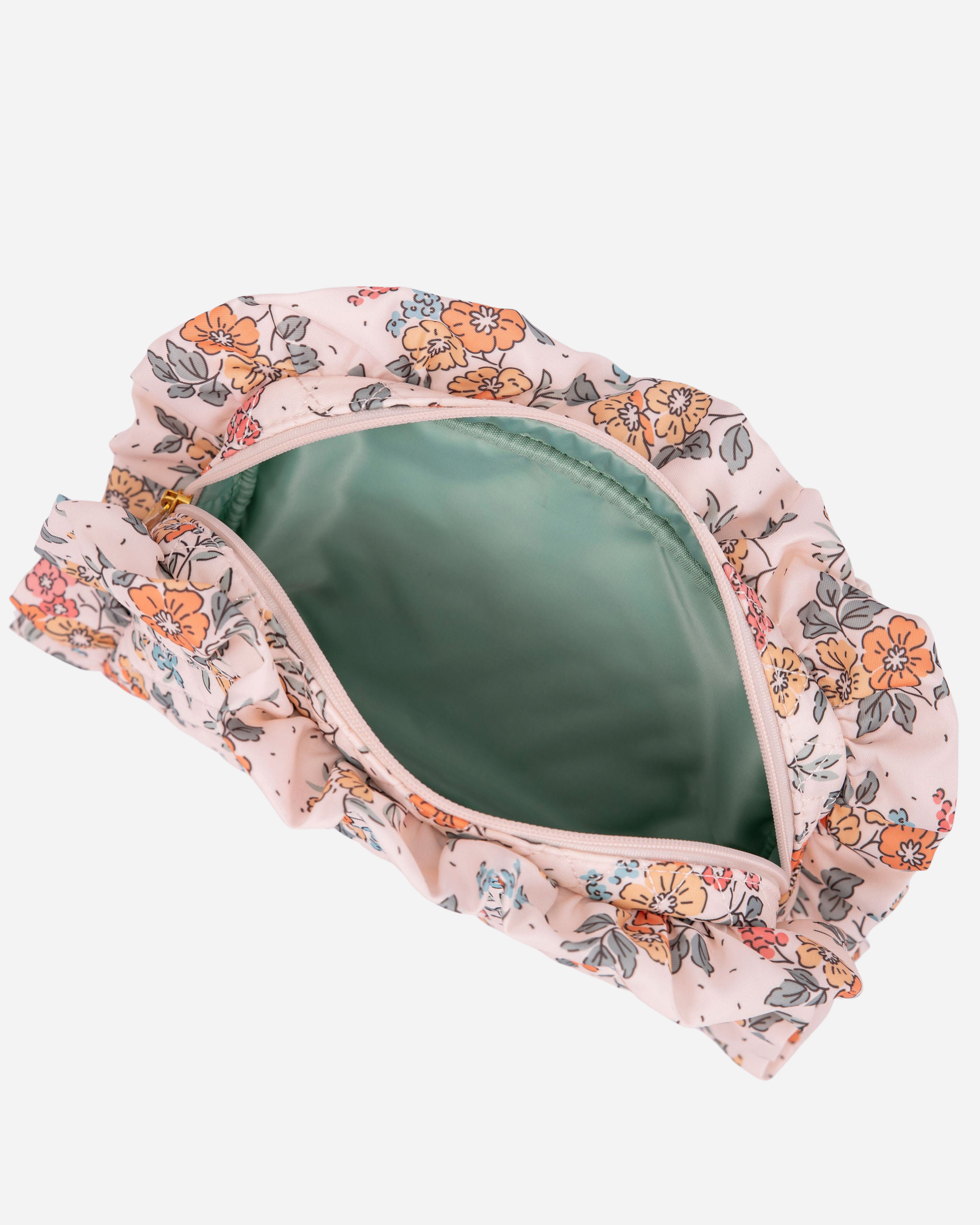 Floral-patterned clutch with a green interior on a white background