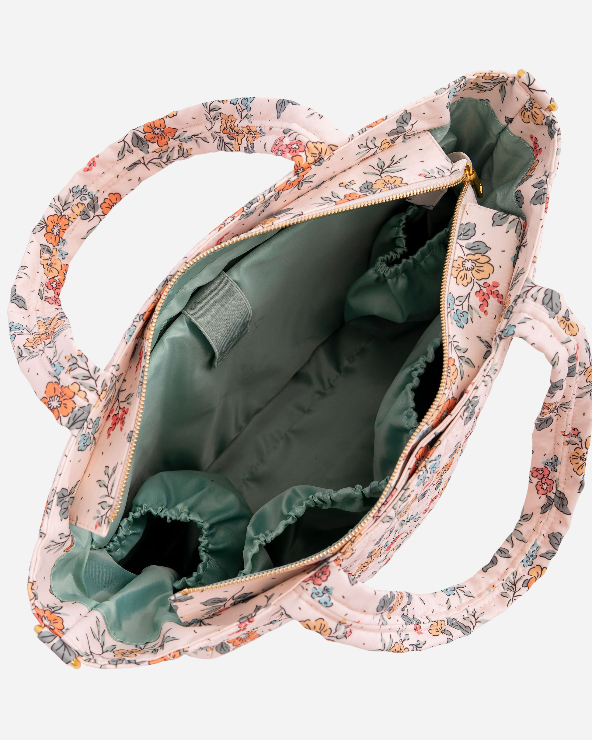 Floral-patterned bag with green interior on a white background