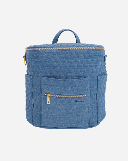 Blue denim backpack with gold zippers on a white background