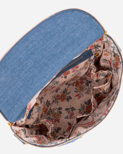 Floral-patterned bag interior with blue exterior on a white background